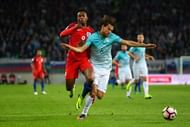LJUBLJANA, SLOVENIA - OCTOBER 11:  Daniel Sturridge of England battles for the ball with Rene Krhin of Slovenia during the FIFA 2018 World Cup Qualifier Group F match between Slovenia and England at Stadion Stozice on October 11, 2016 in Ljubljana, Slovenia.  (Photo by Laurence Griffiths/Getty Images)